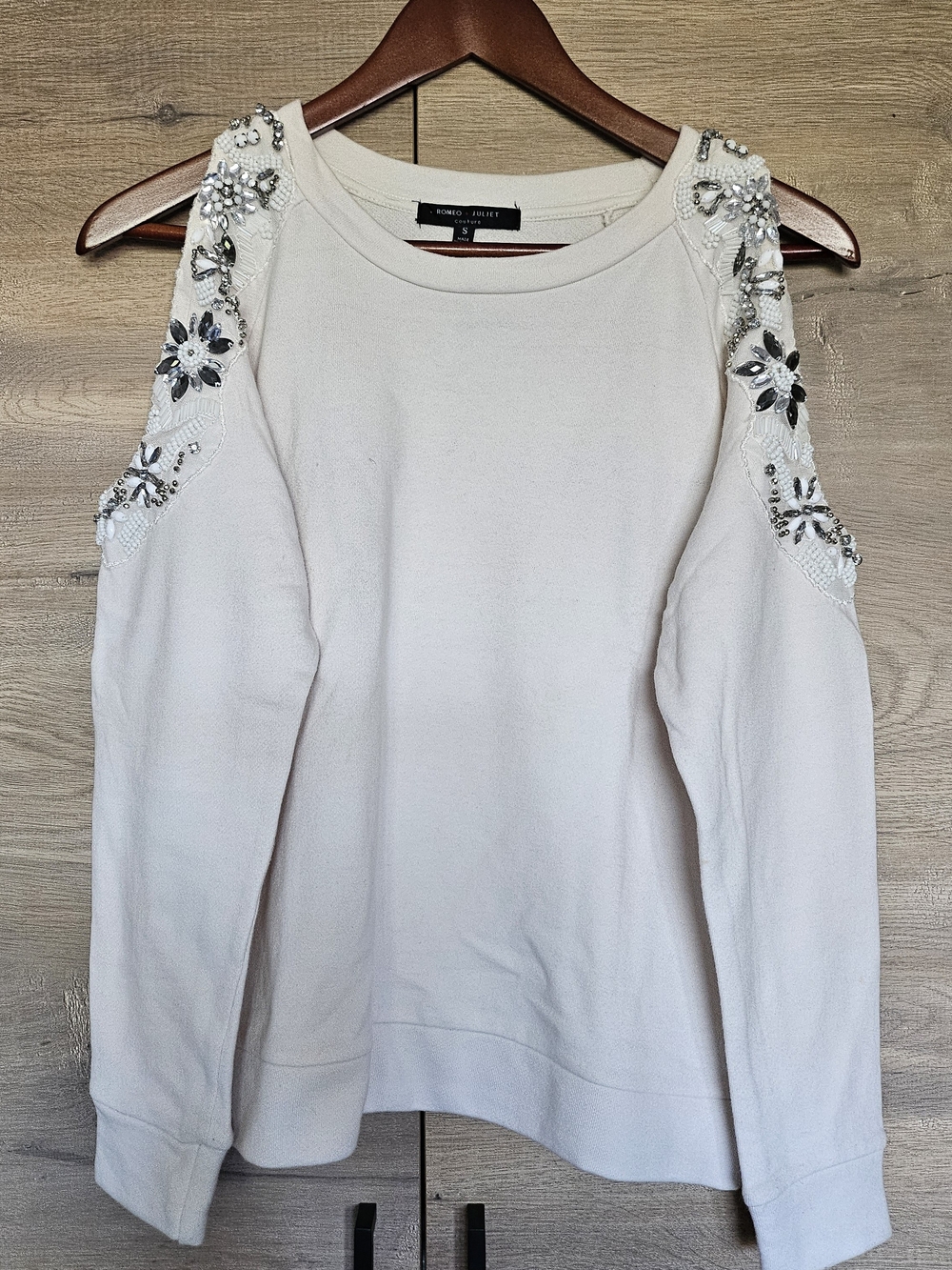 Romeo & Juliet Couture Cream Cold-Shoulder Embellished Sweatshirt